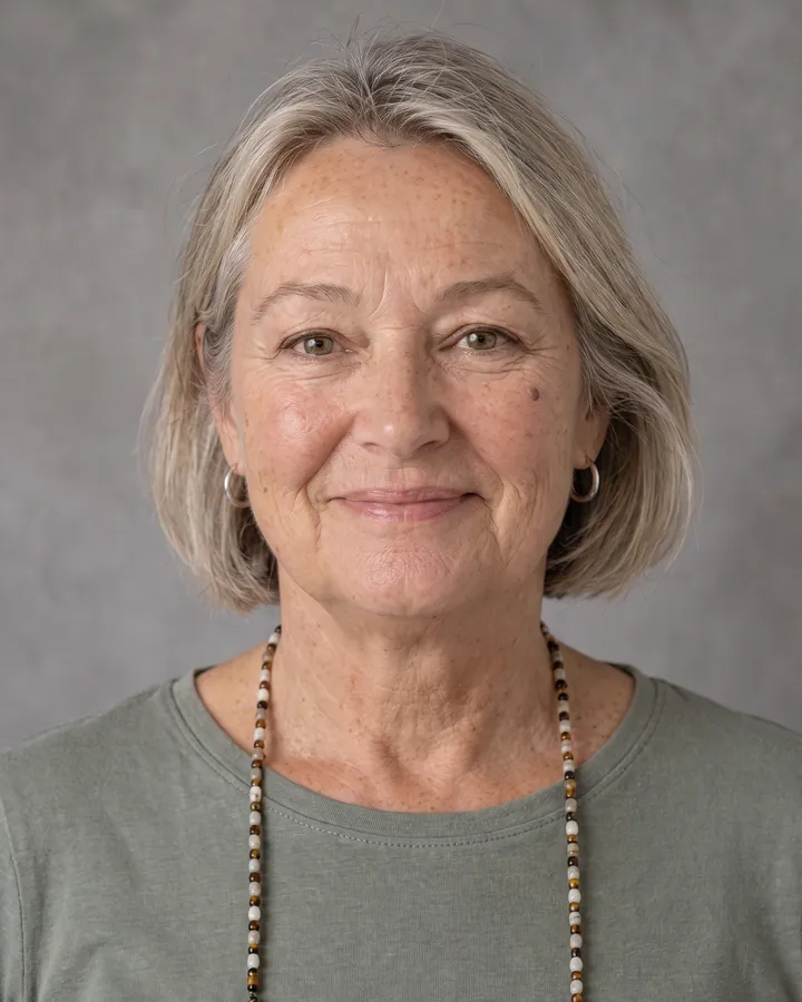 Annie smiling, in a sage-green top